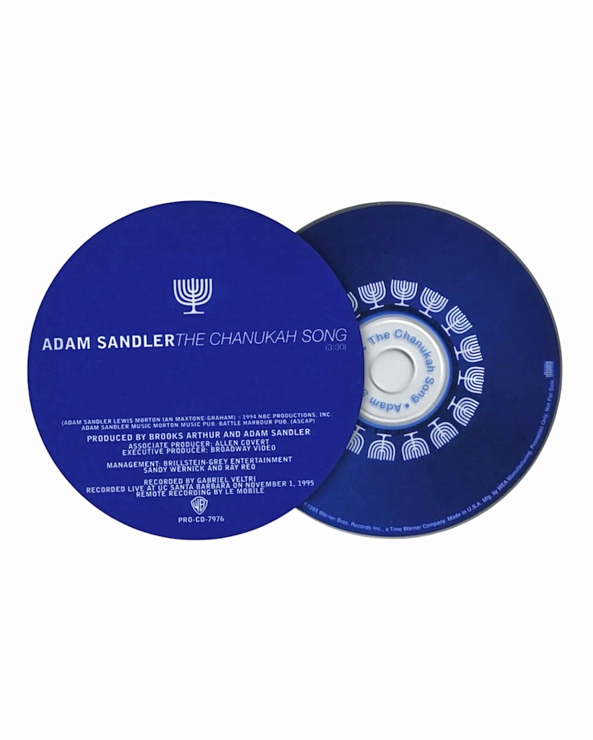 A blue CD single cover and disc for 'The Chanukah Song' by Adam Sandler, displayed on a clean white background.