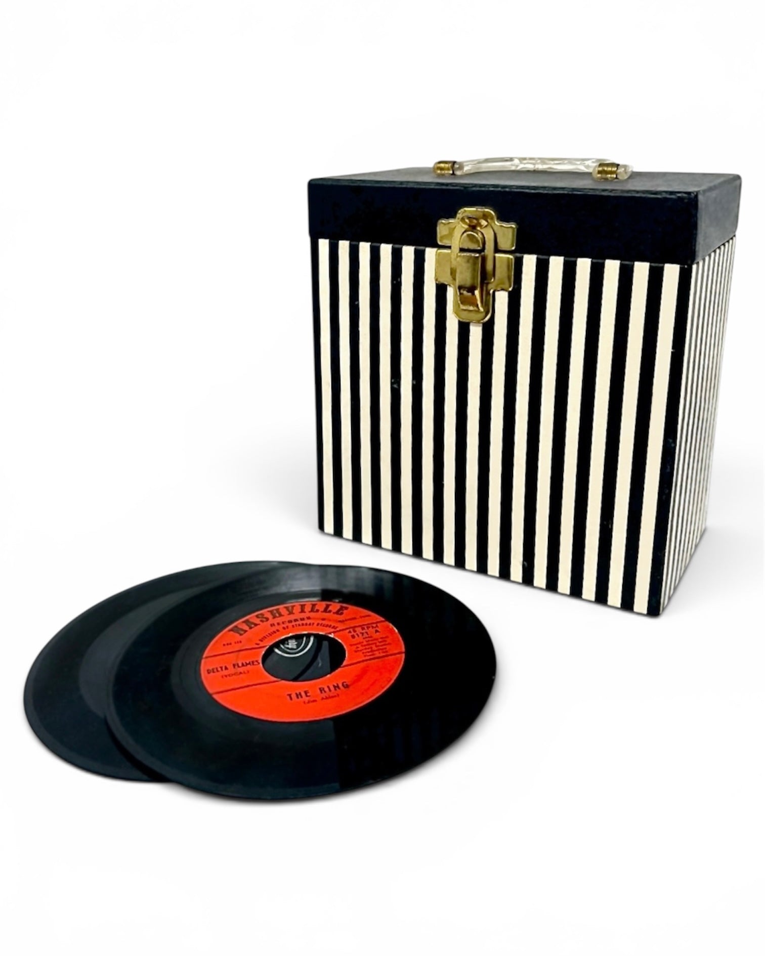 A black and white vertically striped wooden record case with a gold-tone latch, shown next to two black vinyl records on a white background.