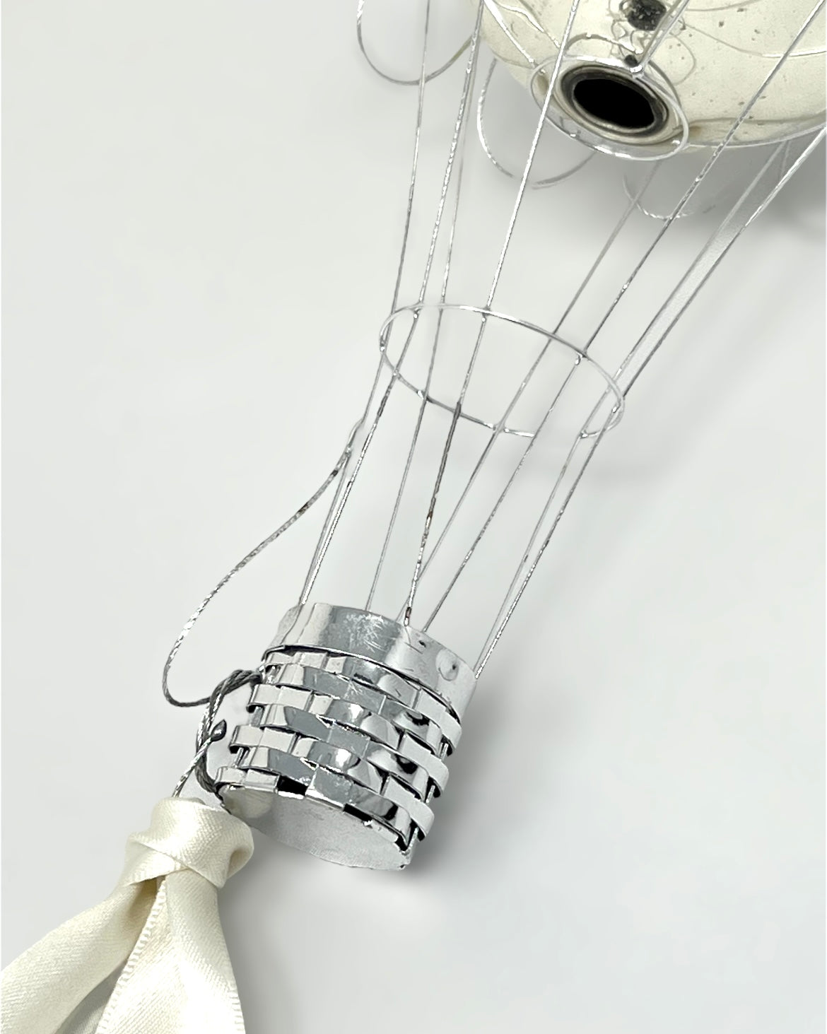 Close-up of a decorative hot air balloon model on a white background