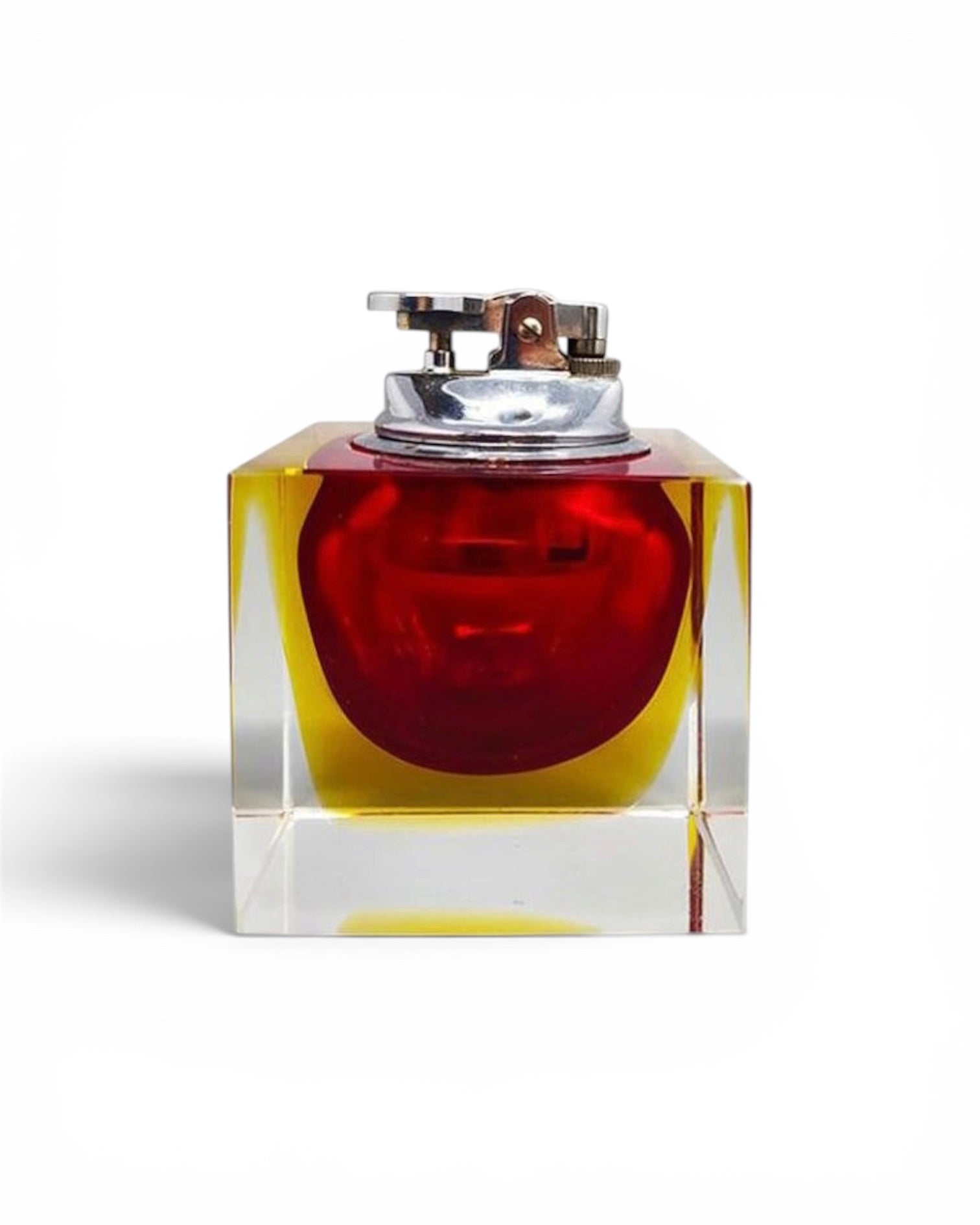 A square red and yellow murano glass lighter set against a plain white background.