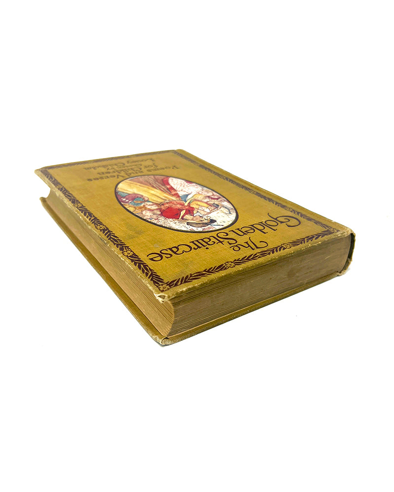 Antique book titled 'The Golden Staircase, Poems and Verses for Children' (1907) with decorative cover on a white background